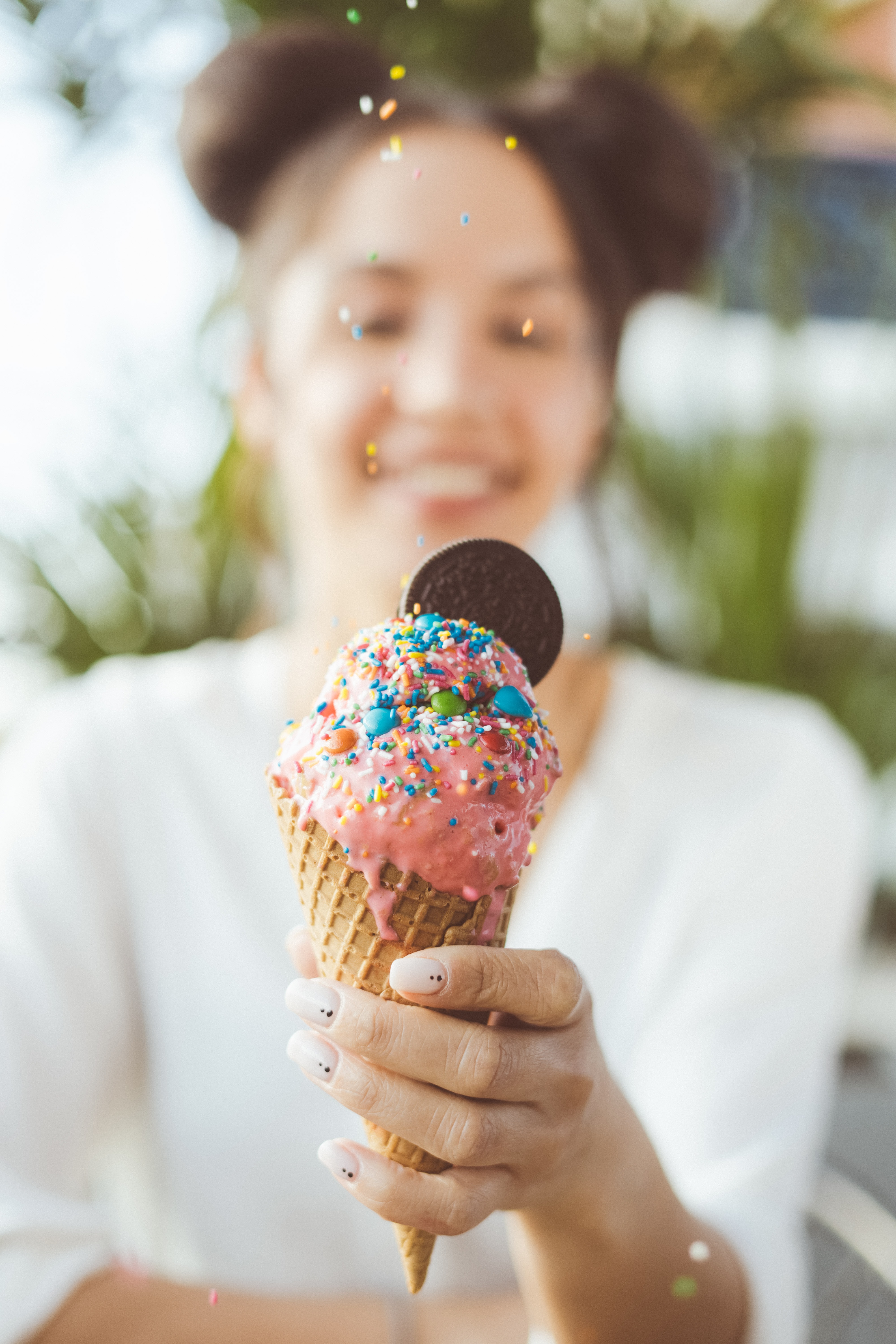 happy woman holding ice cream cone